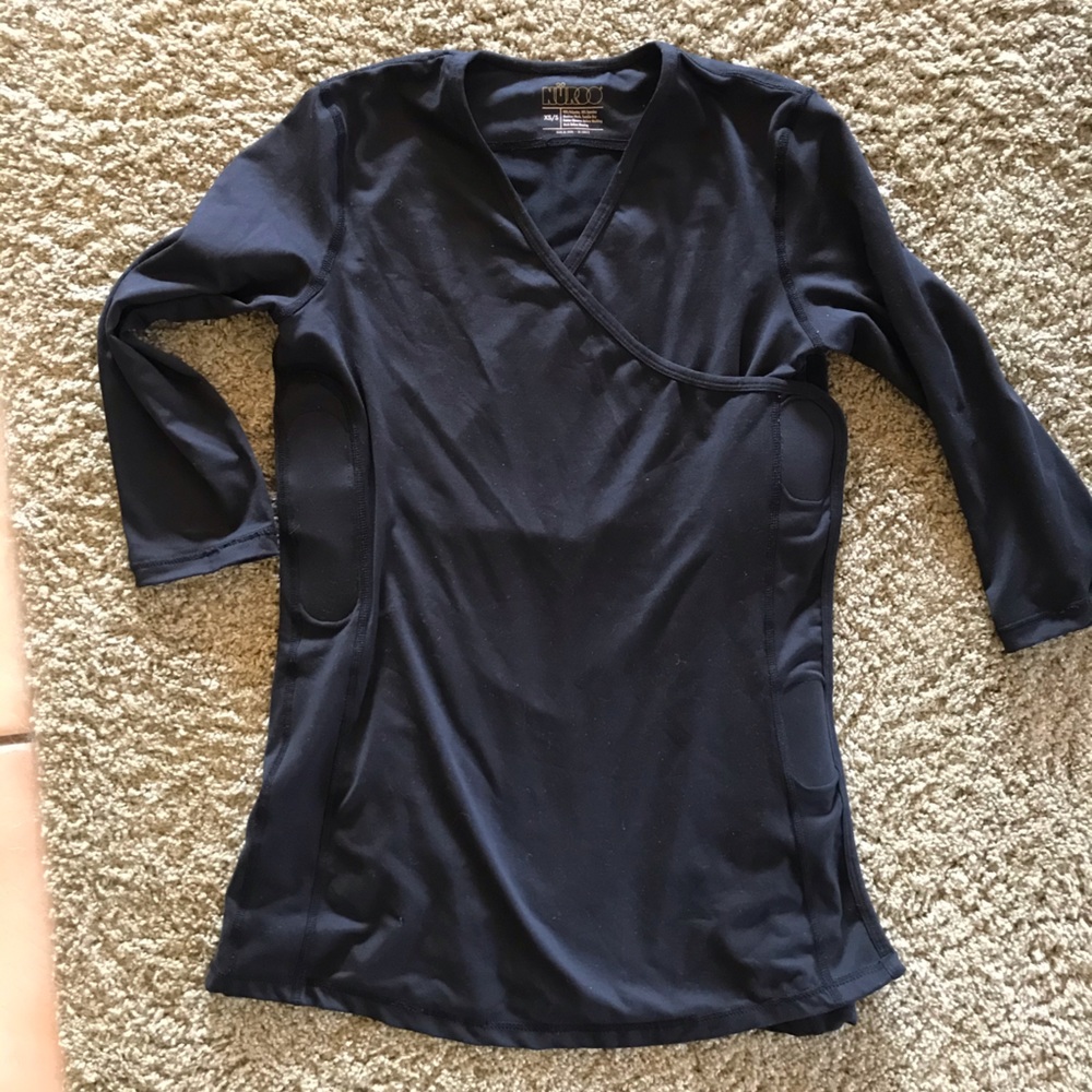 Nuroo Baby wearing 3/4 length shirt